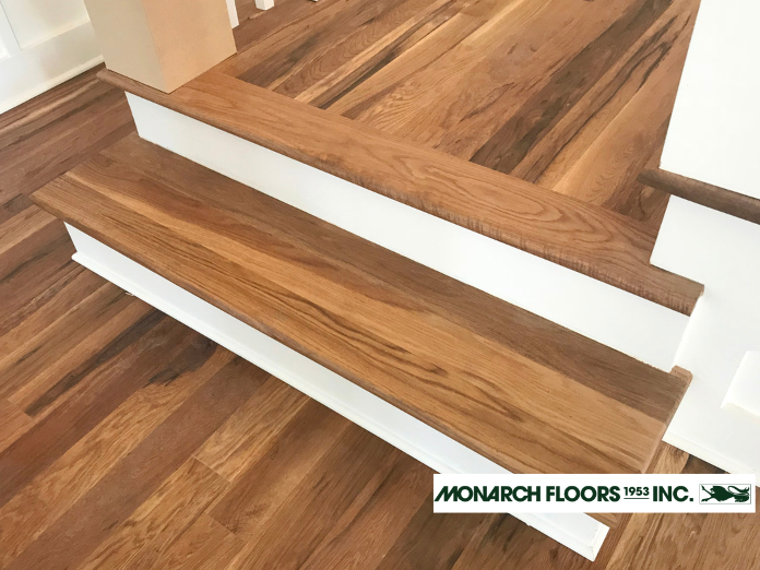 Hardwood flooring extending from the living room to the kitchen